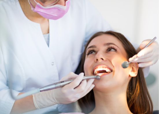 Patient receiving dental treatment from an oral surgeon